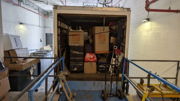 Lemon Team Moving truck loaded with boxes at a Westchester storage facility loading dock